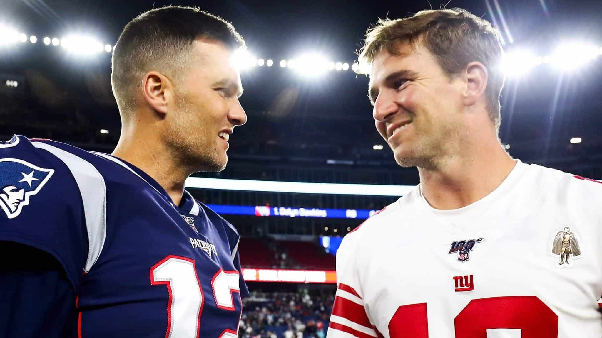 FOXBOROUGH, MA - AUGUST 29: Tom Brady #12 of the New England Patriots greets Eli Manning #10 of the New York Giants after a preseason game at Gillette Stadium on August 29, 2019 in Foxborough, Massachusetts.