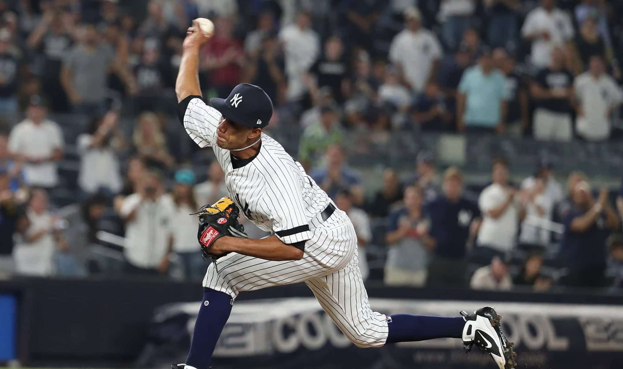 NEW YORK, NEW YORK - AUGUST 11: Adonis Rosa #73 of the New York Yankees makes his Major League debut pitching against the Baltimore Orioles during their game at Yankee Stadium on August 11, 2019 in New York City.