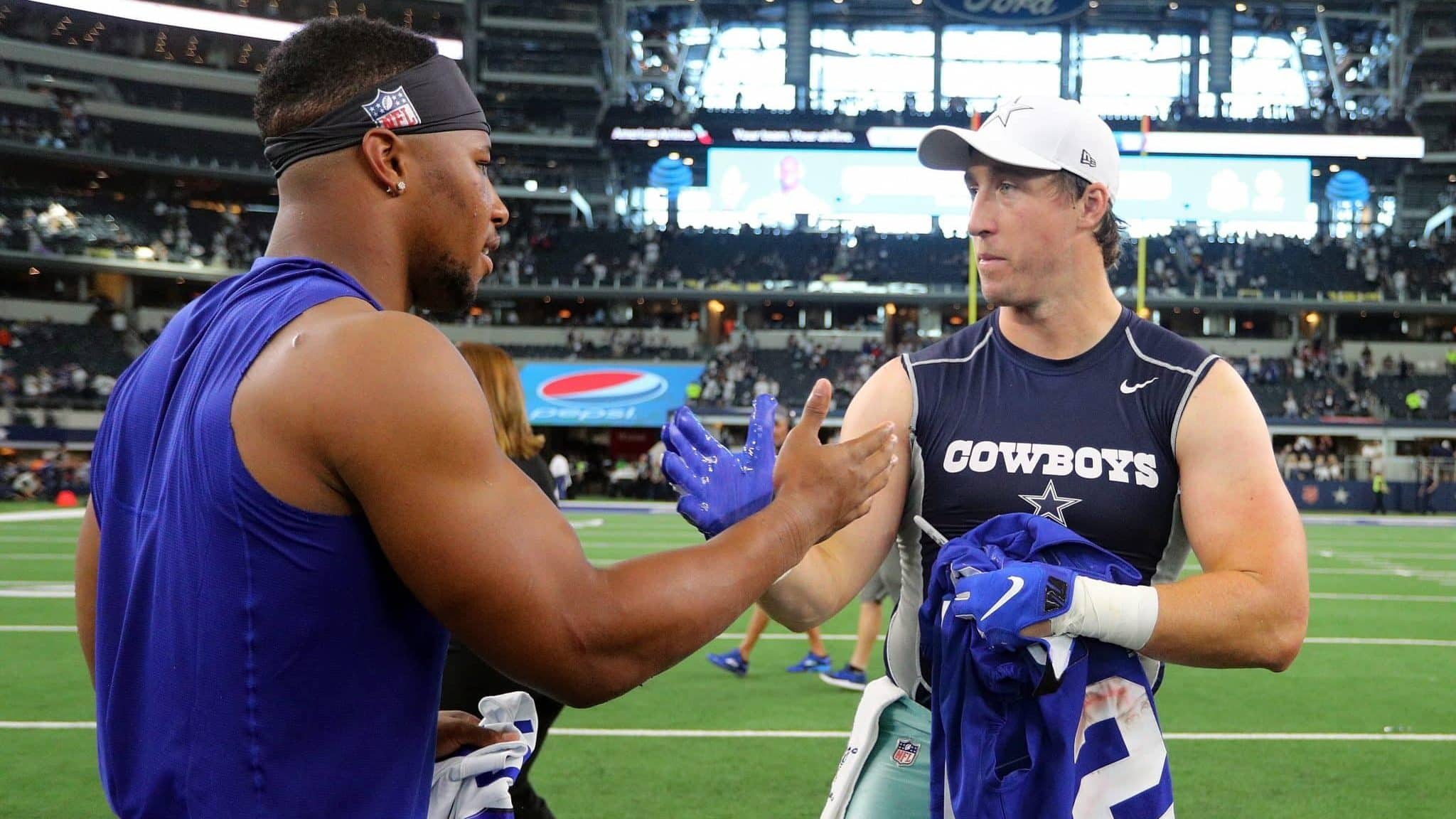 ARLINGTON, TEXAS - SEPTEMBER 08: Saquon Barkley #26 of the New York Giants and Sean Lee #50 of the Dallas Cowboys shakes hands after trading jerseys after the game at AT&T Stadium on September 08, 2019 in Arlington, Texas.