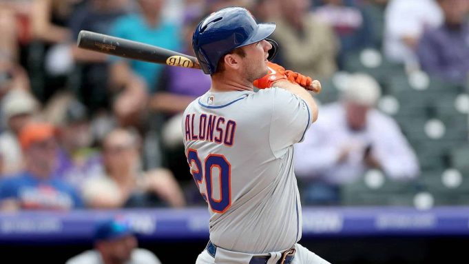 DENVER, COLORADO - SEPTEMBER 18: Pete Alonso #20 of the New York Mets hits a solo home run in the sixth inning against the Colorado Rockies at Coors Field on September 18, 2019 in Denver, Colorado.