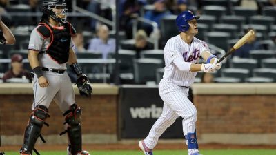 NEW YORK, NEW YORK - SEPTEMBER 24: Michael Conforto #30 of the New York Mets watches his two run home run in the bottom of the ninth inning to tie the game as Jorge Alfaro #38 of the Miami Marlins defends at Citi Field on September 24, 2019 in the Flushing neighborhood of the Queens borough of New York City.