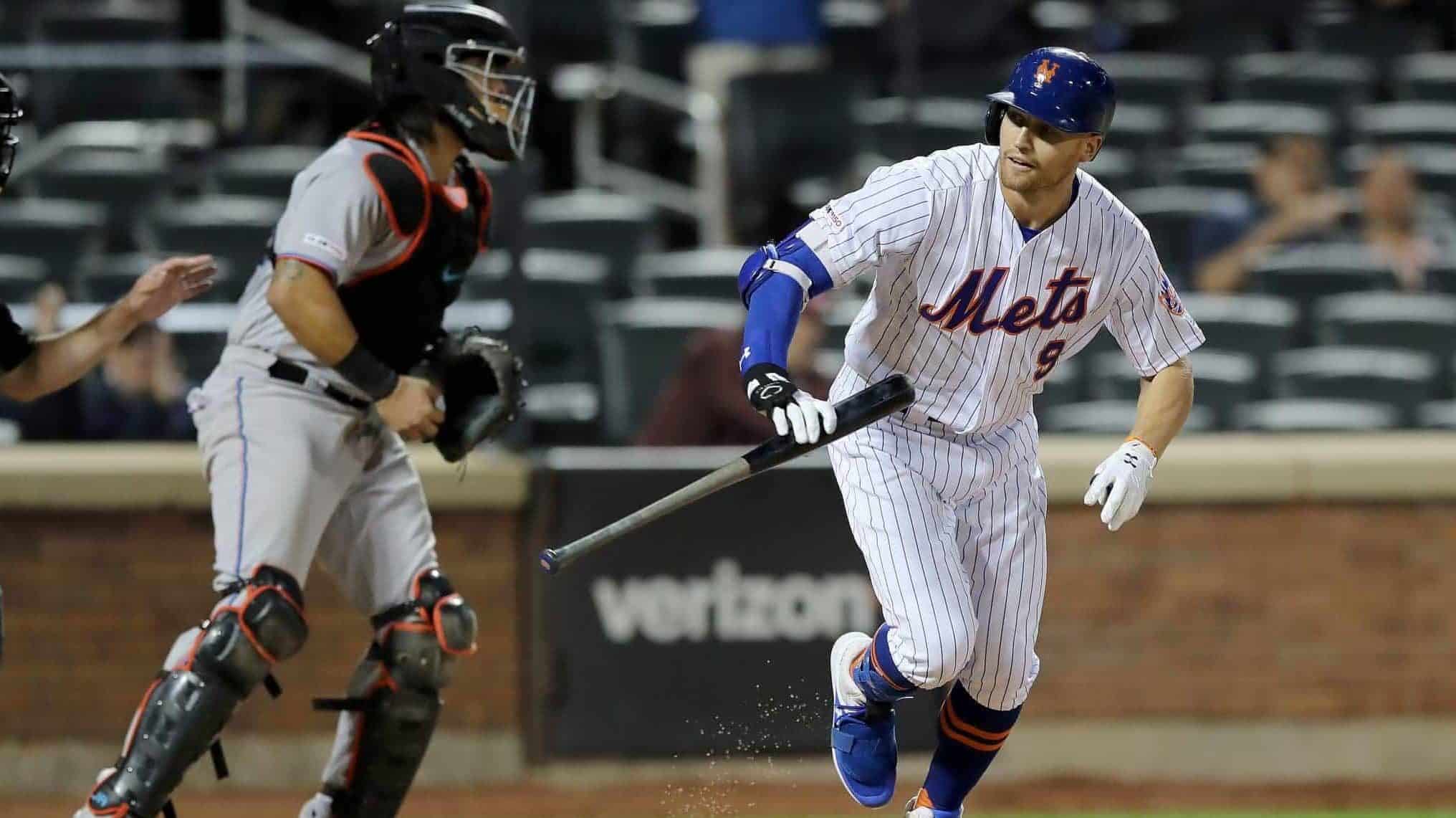 NEW YORK, NEW YORK - SEPTEMBER 24: Brandon Nimmo #9 of the New York Mets heads to first after he is walked with the bases loaded to score the game winning run in the 11th inning as catcher Jorge Alfaro #38 of the Miami Marlins reacts at Citi Field on September 24, 2019 in the Flushing neighborhood of the Queens borough of New York City.The New York Mets defeated the Miami Marlins 5-4 in 11 innings.
