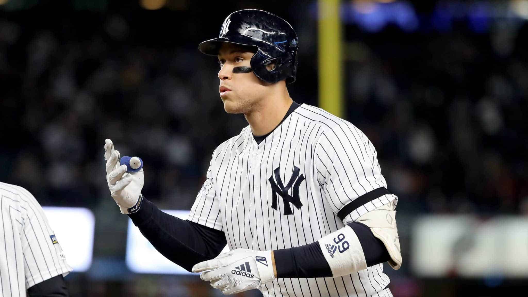 NEW YORK, NEW YORK - OCTOBER 18: Aaron Judge #99 of the New York Yankees celebrates after hitting a single against Justin Verlander #35 of the Houston Astros during the first inning in game five of the American League Championship Series at Yankee Stadium on October 18, 2019 in New York City.