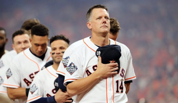 HOUSTON, TEXAS - OCTOBER 22: AJ Hinch #14 of the Houston Astros stands for the national anthem prior to Game One of the 2019 World Series against the Washington Nationals at Minute Maid Park on October 22, 2019 in Houston, Texas.