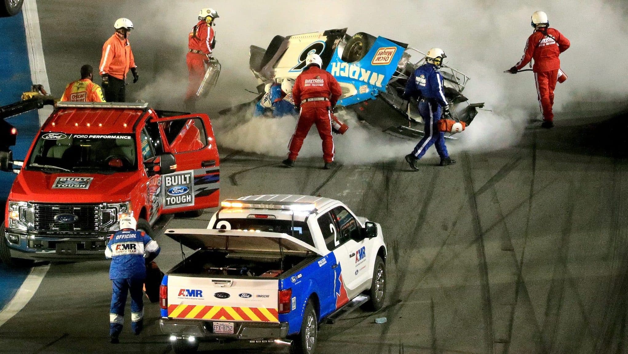 DAYTONA BEACH, FLORIDA - FEBRUARY 17: Track workers attend to Ryan Newman, driver of the #6 Koch Industries Ford, following a crash during the NASCAR Cup Series 62nd Annual Daytona 500 at Daytona International Speedway on February 17, 2020 in Daytona Beach, Florida.