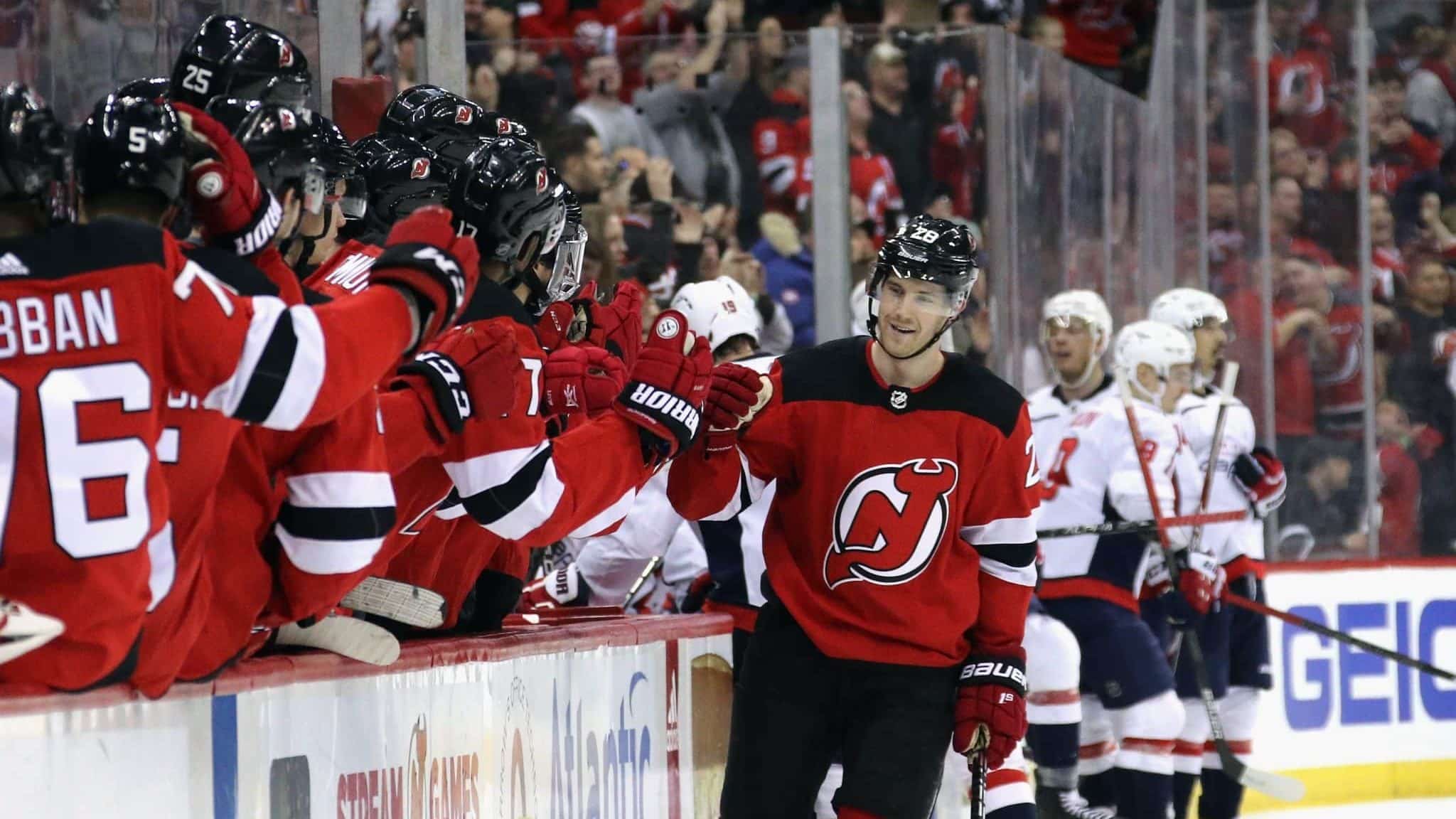 NEWARK, NEW JERSEY - FEBRUARY 22: Damon Severson #28 of the New Jersey Devils celebrates his game winning goal at 18:01 of the third period against the Washington Capitals at the Prudential Center on February 22, 2020 in Newark, New Jersey. The Devils defeated the Capitals 3-2.
