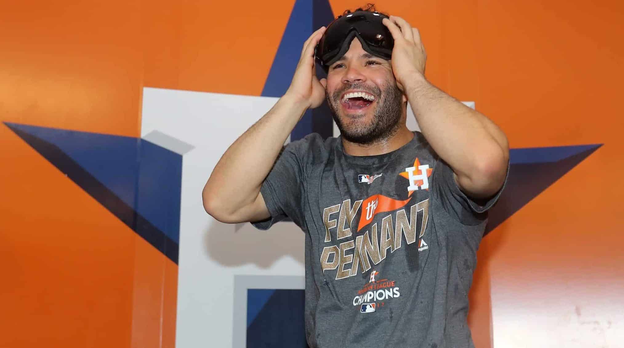 HOUSTON, TX - OCTOBER 21: Jose Altuve #27 of the Houston Astros celebrates in the locker room after defeating the New York Yankees by a score of 4-0 to win Game Seven of the American League Championship Series at Minute Maid Park on October 21, 2017 in Houston, Texas. The Houston Astros advance to face the Los Angeles Dodgers in the World Series.
