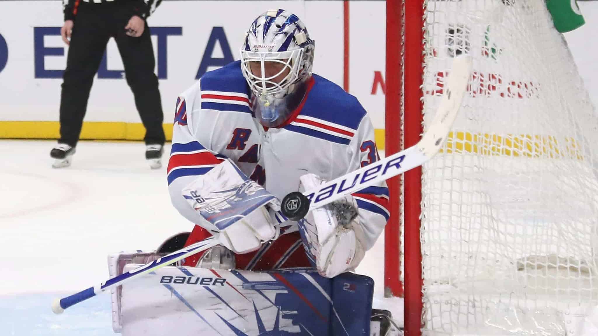 LOS ANGELES, CALIFORNIA - DECEMBER 10: Henrik Lundqvist #30 of the New York Rangers sticks aside a 2po shot against the Los Angeles Kings at the Staples Center on December 10, 2019 in Los Angeles, California.