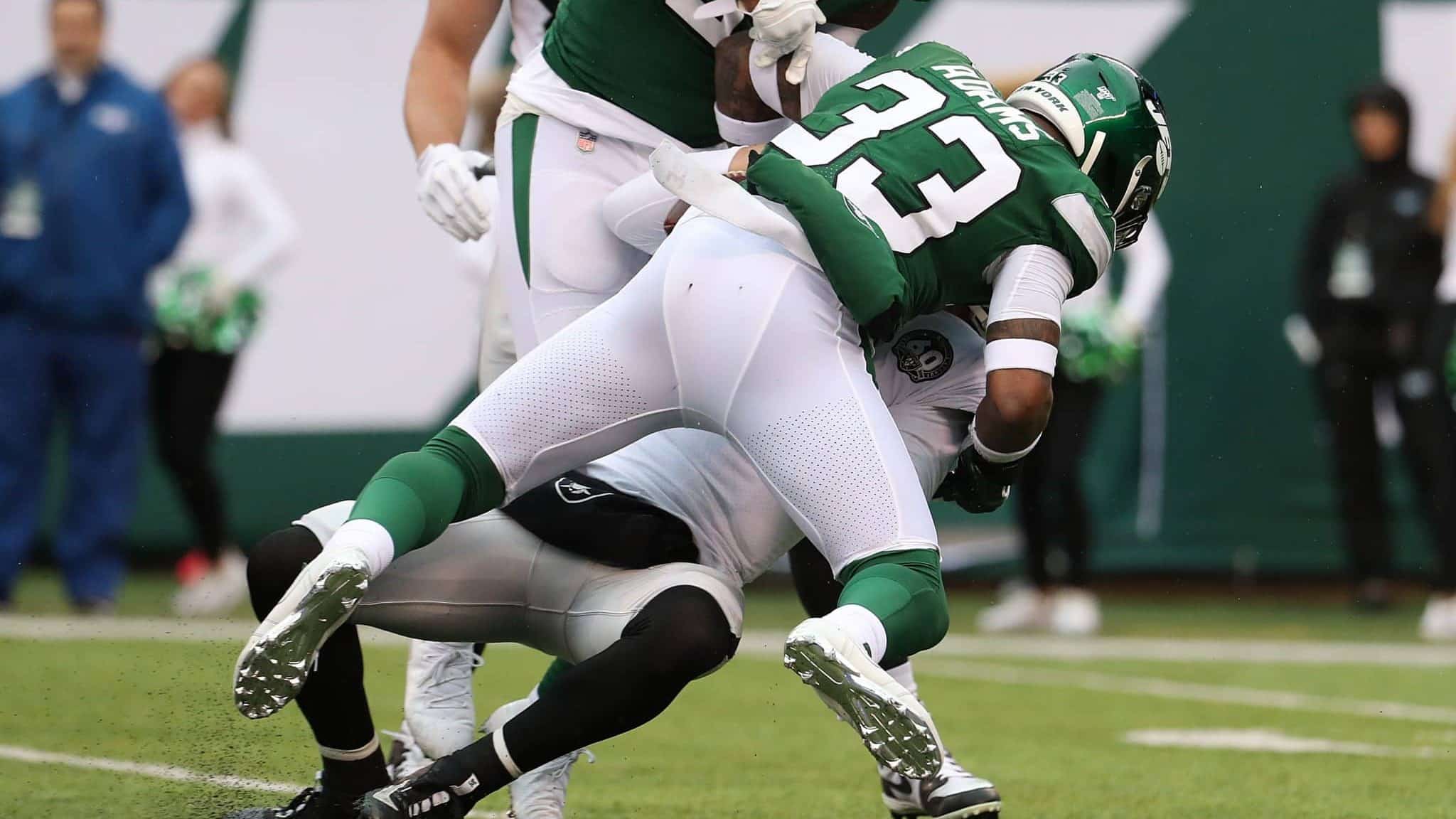 EAST RUTHERFORD, NEW JERSEY - NOVEMBER 24: Jamal Adams #33 of the New York Jets sacks Derek Carr #4 of the Oakland Raiders during their game at MetLife Stadium on November 24, 2019 in East Rutherford, New Jersey.