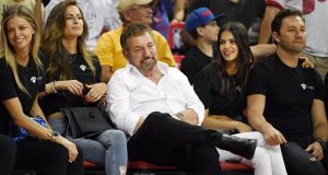 LAS VEGAS, NEVADA - JULY 07: (3rd L-R) Executive chairman and CEO of The Madison Square Garden Company and executive chairman of MSG Networks James L. Dolan, model Marcela Braga and Tao Group partner Jason Strauss attend a game between the New York Knicks and the Phoenix Suns during the 2019 NBA Summer League at the Thomas & Mack Center on July 7, 2019 in Las Vegas, Nevada. NOTE TO USER: User expressly acknowledges and agrees that, by downloading and or using this photograph, User is consenting to the terms and conditions of the Getty Images License Agreement.