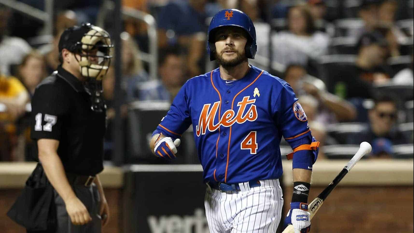 NEW YORK, NEW YORK - SEPTEMBER 07: Pinch hitter Jed Lowrie #4 of the New York Mets walks back to the dugout after striking out in the fourth inning against the Philadelphia Phillies at Citi Field on September 07, 2019 in New York City.