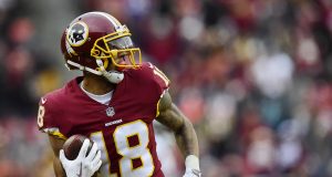 LANDOVER, MD - DECEMBER 24: Wide receiver Josh Doctson #18 of the Washington Redskins scores a touchdown against the Denver Broncos in the fourth quarter at FedExField on December 24, 2017 in Landover, Maryland.
