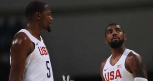 RIO DE JANEIRO, BRAZIL - AUGUST 08: Kevin Durant #5 and Kyrie Irving #10 of United States talk on the court during the Men's Priliminary Round between the United States and Venezuela on Day 3 of the Rio 2016 Olympic Games at Carioca Arena 1 on August 8, 2016 in Rio de Janeiro, Brazil.