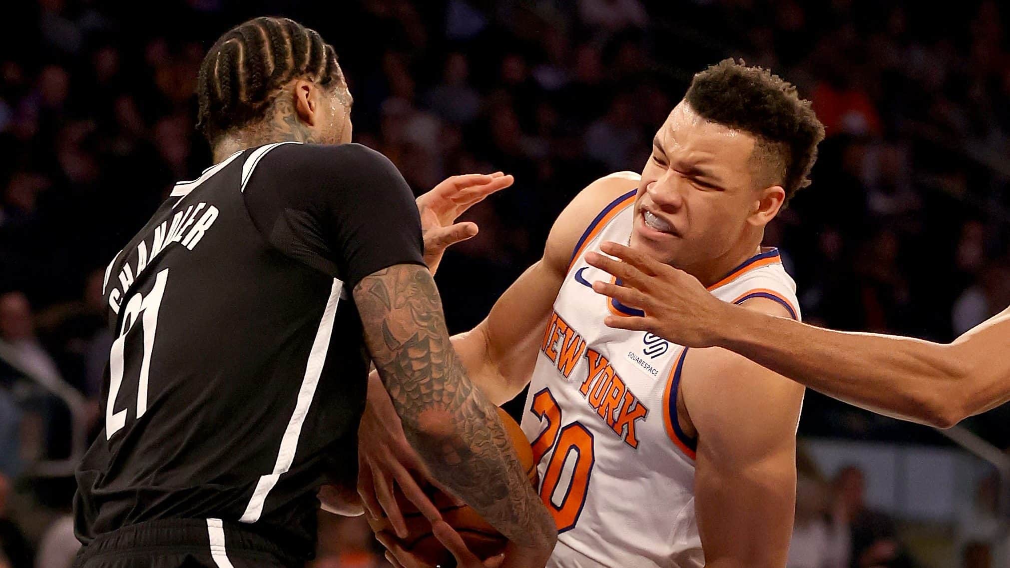 NEW YORK, NEW YORK - JANUARY 26: Wilson Chandler #21 of the Brooklyn Nets and Kevin Knox II #20 of the New York Knicks fight for the ball at Madison Square Garden on January 26, 2020 in New York City.NOTE TO USER: User expressly acknowledges and agrees that, by downloading and or using this photograph, User is consenting to the terms and conditions of the Getty Images License Agreement.