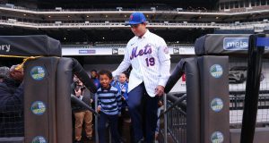NEW YORK, NY - JANUARY 24: Luis Rojas, the new manager of the New York Mets walks onto the field with his son Luis Felipe, after his introductory press conference at Citi Field on January 24, 2020 in New York City.