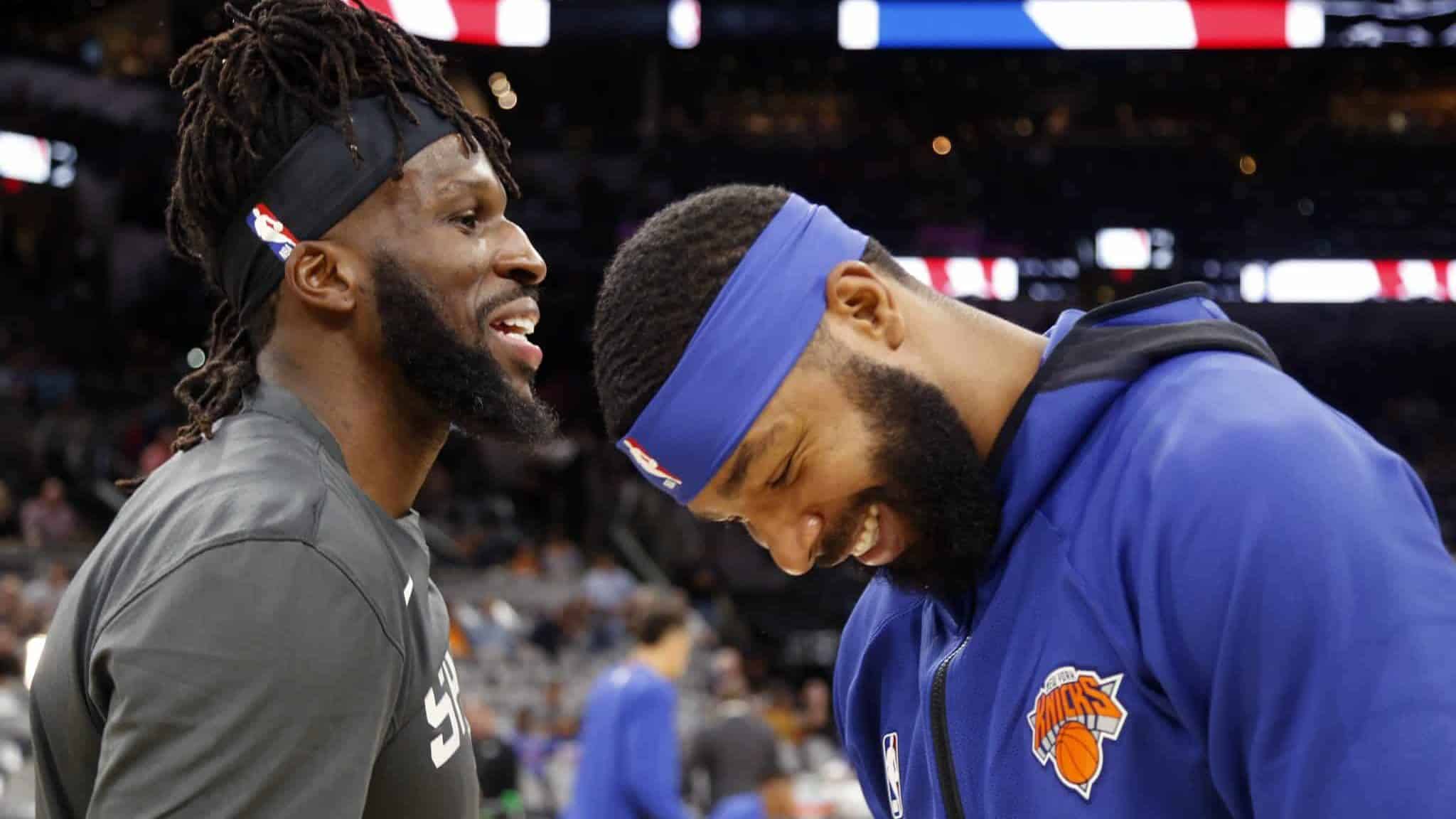 SAN ANTONIO,TX - OCTOBER 23: Marcus Morris #13 of the New York Knicks jokes with DeMarre Carroll #77 of the San Antonio Spurs before the start of their game at AT&T Center on October 23 , 2019 in San Antonio, Texas. NOTE TO USER: User expressly acknowledges and agrees that , by downloading and or using this photograph, User is consenting to the terms and conditions of the Getty Images License Agreement.