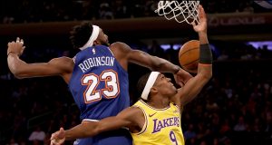 NEW YORK, NEW YORK - JANUARY 22: Rajon Rondo #9 of the Los Angeles Lakers heads for the basket as Mitchell Robinson #23 of the New York Knicks defends at Madison Square Garden on January 22, 2020 in New York City.NOTE TO USER: User expressly acknowledges and agrees that, by downloading and or using this photograph, User is consenting to the terms and conditions of the Getty Images License Agreement.