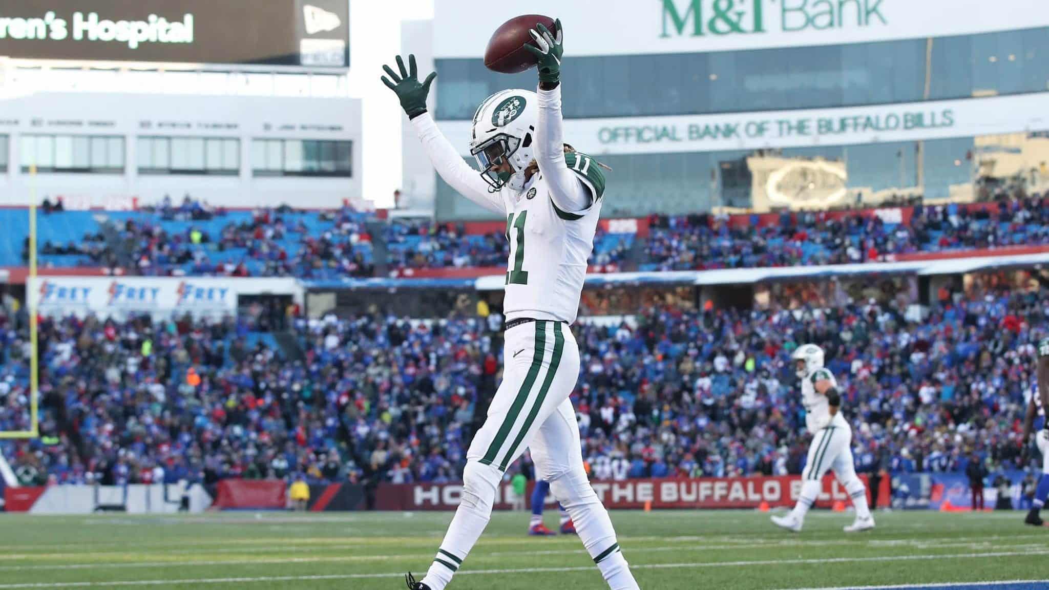 BUFFALO, NY - DECEMBER 09: Robby Anderson #11 of the New York Jets celebrates after scoring a touchdown in the fourth quarter during NFL game action against the Buffalo Bills at New Era Field on December 9, 2018 in Buffalo, New York.