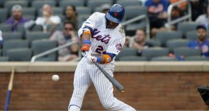 NEW YORK, NEW YORK - SEPTEMBER 12: Robinson Cano #24 of the New York Mets connects on his fifth inning home run against the Arizona Diamondbacks at Citi Field on September 12, 2019 in New York City.