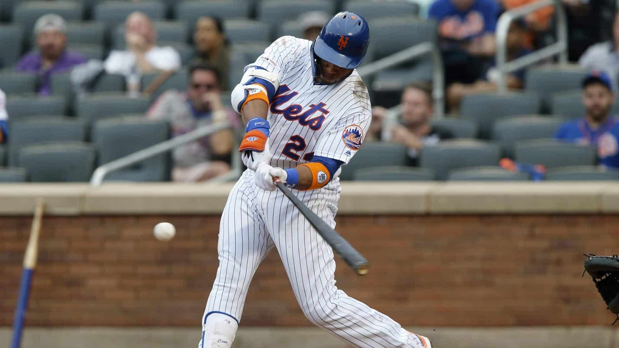 NEW YORK, NEW YORK - SEPTEMBER 12: Robinson Cano #24 of the New York Mets connects on his fifth inning home run against the Arizona Diamondbacks at Citi Field on September 12, 2019 in New York City.