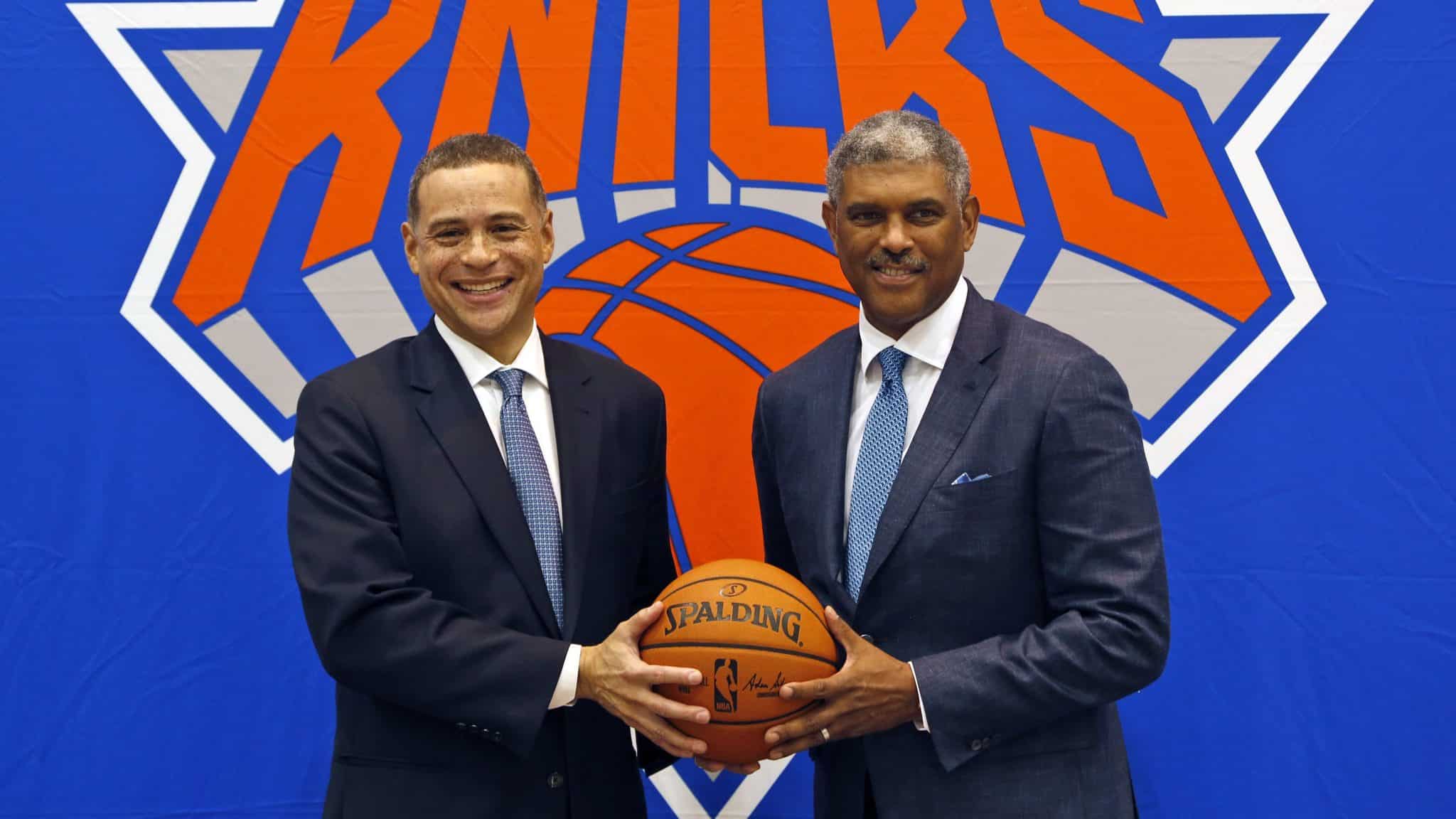 This July 17, 2017, file photo shows New York Knicks general manager Scott Perry (left) and president Steve Mills posing for a picture after a news conference in Greenburgh, New York. Mills and Perry are trying to change the identity of the New York Knicks.