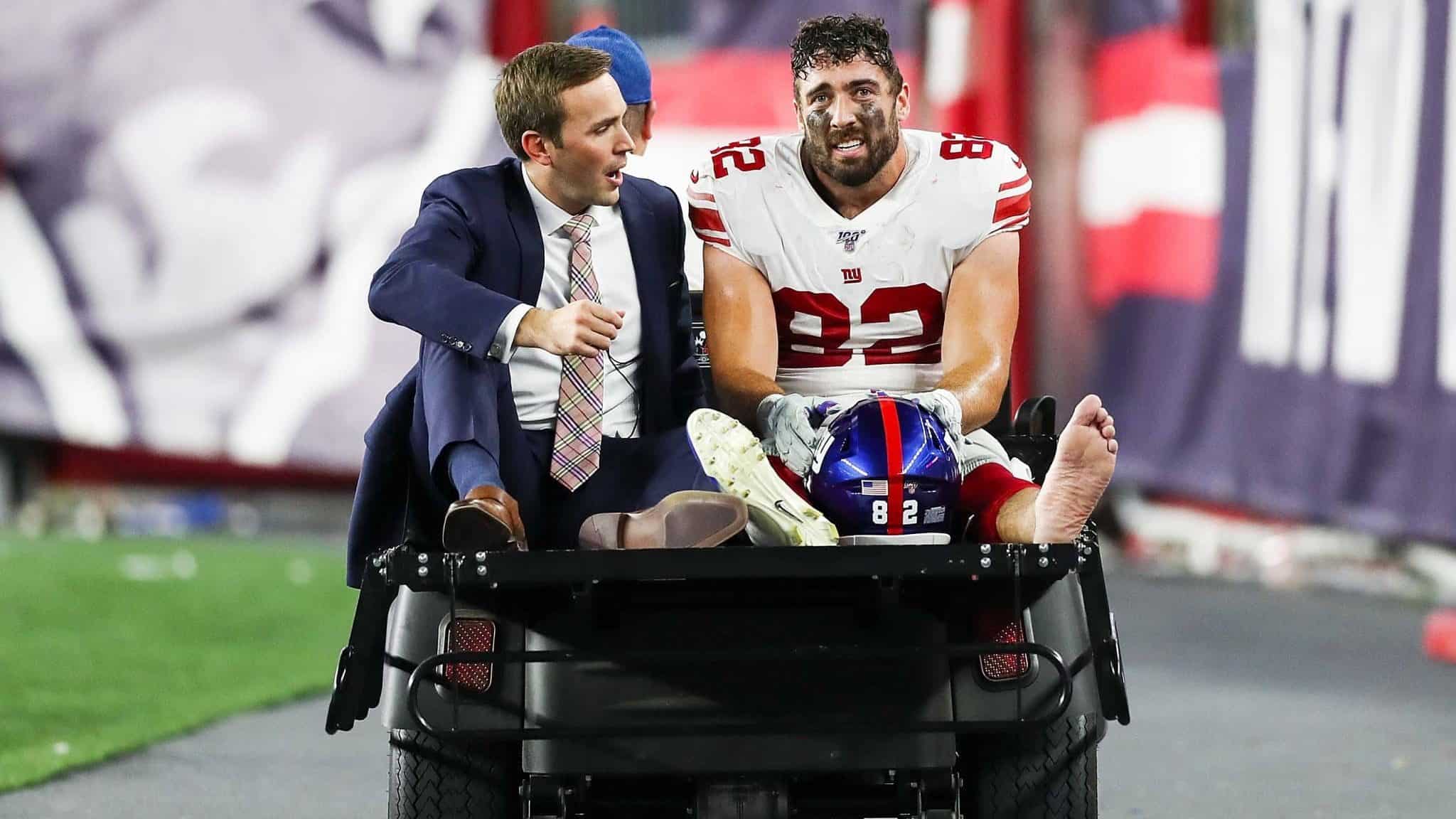 FOXBOROUGH, MA - AUGUST 29: Scott Simonson #82 of the New York Giants is carted off the field after an injury during a preseason game against the New England Patriots at Gillette Stadium on August 29, 2019 in Foxborough, Massachusetts.