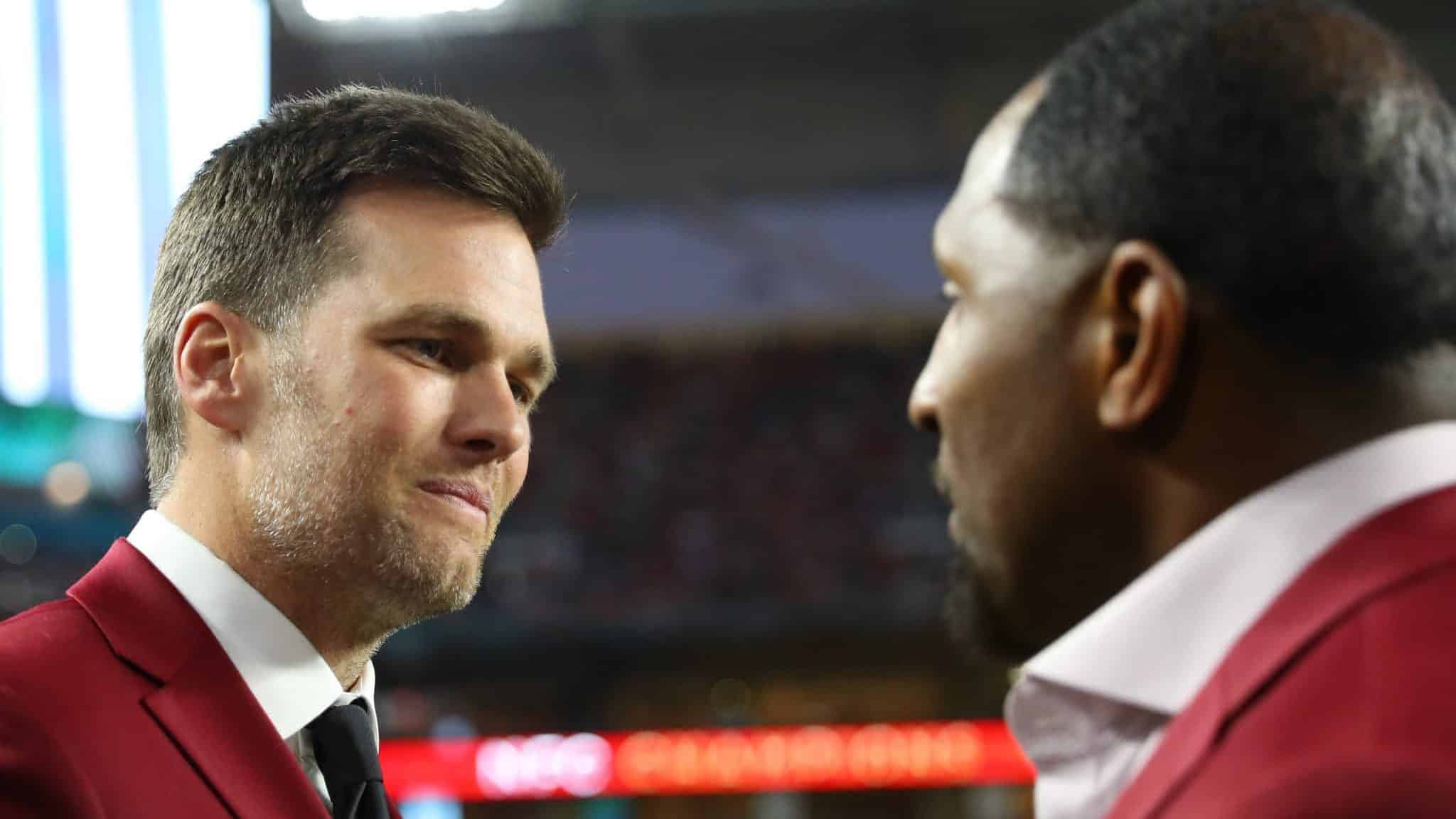 MIAMI, FLORIDA - FEBRUARY 02: Tom Brady of the New England Patriots talks with NFL Hall of Famer Ray Lewis of the Baltimore Ravens prior to Super Bowl LIV between the San Francisco 49ers and the Kansas City Chiefs at Hard Rock Stadium on February 02, 2020 in Miami, Florida.