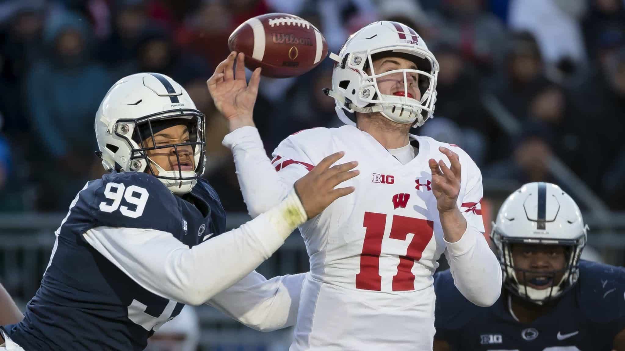 STATE COLLEGE, PA - NOVEMBER 10: Yetur Gross-Matos #99 of the Penn State Nittany Lions hits the arm of Jack Coan #17 of the Wisconsin Badgers as he throws during the second half at Beaver Stadium on November 10, 2018 in State College, Pennsylvania.