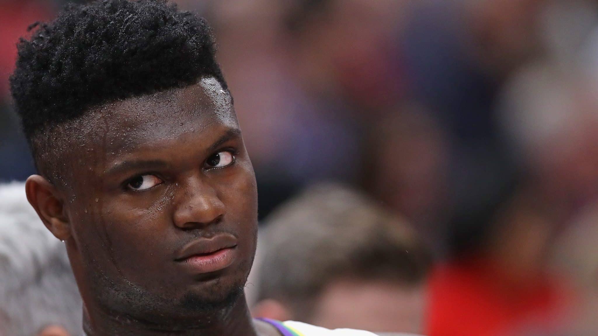 CHICAGO, ILLINOIS - FEBRUARY 06: Zion Williamson #1 of the New Orleans Pelicans watches from the bench as teammates take on the Chicago Bulls at the United Center on February 06, 2020 in Chicago, Illinois. NOTE TO USER: User expressly acknowledges and agrees that, by downloading and or using this photograph, User is consenting to the terms and conditions of the Getty Images License Agreement.