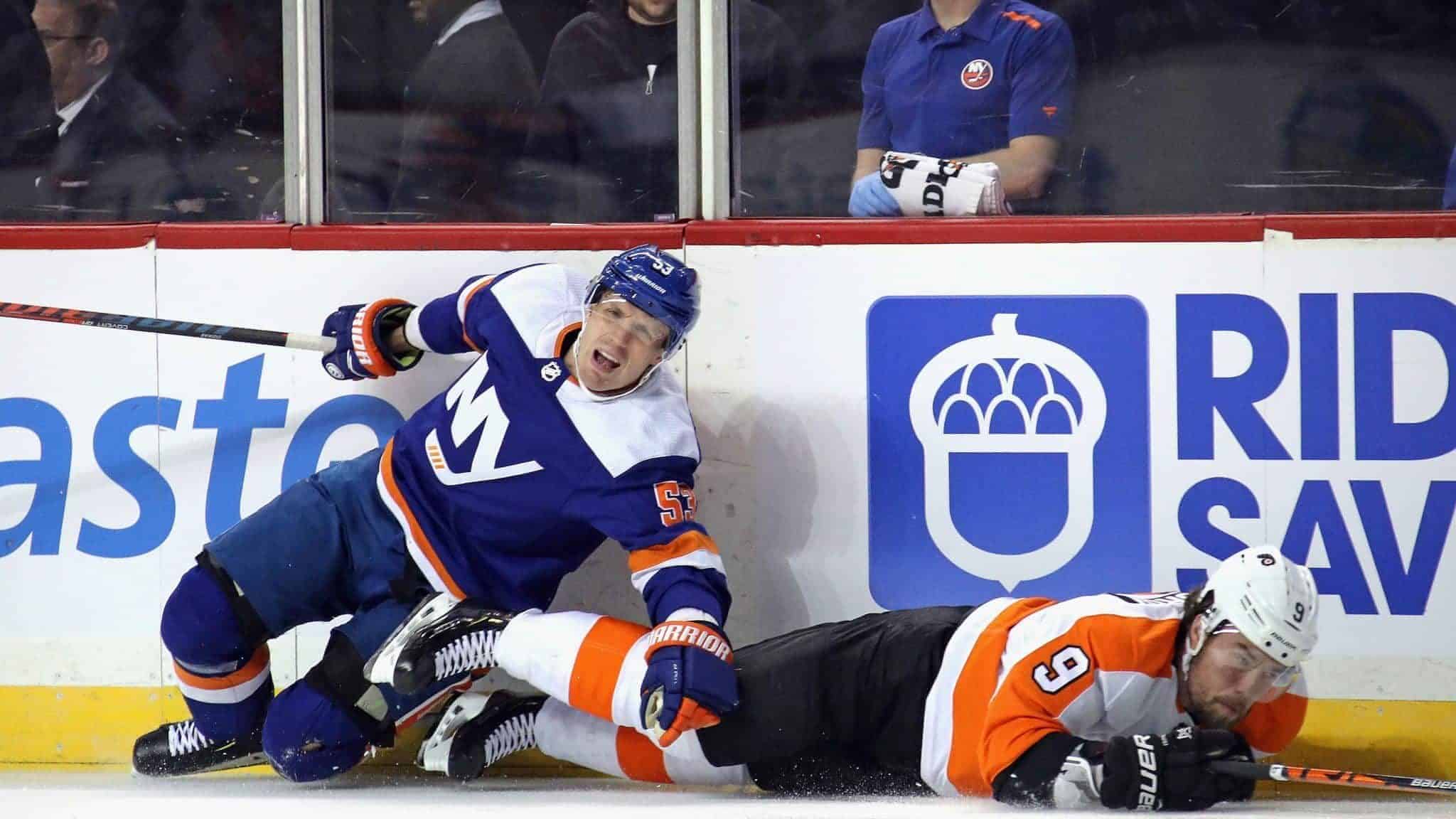 NEW YORK, NEW YORK - FEBRUARY 11: Casey Cizikas #53 of the New York Islanders is injured as he checks Ivan Provorov #9 of the Philadelphia Flyers during the first period at the Barclays Center on February 11, 2020 in the Brooklyn borough of New York City.