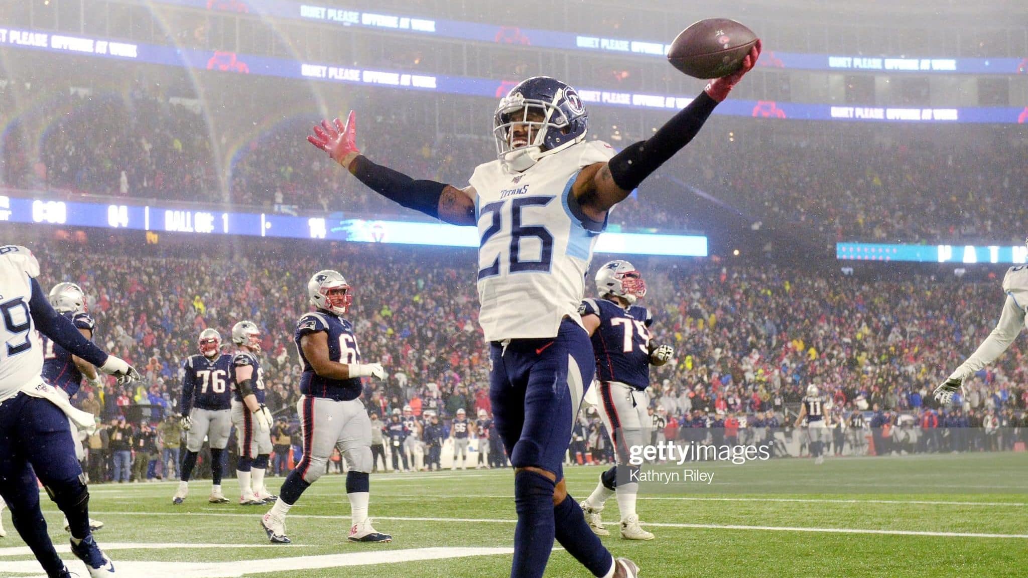 FOXBOROUGH, MASSACHUSETTS - JANUARY 04: Logan Ryan #26 of the Tennessee Titans scores a touchdown against the New England Patriots in the fourth quarter of the AFC Wild Card Playoff game at Gillette Stadium on January 04, 2020 in Foxborough, Massachusetts.