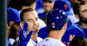 NEW YORK, NEW YORK - SEPTEMBER 25: Brandon Nimmo #9 and Pete Alonso #20 of the New York Mets celebrates with teammates after Alonso hit a home run in the second inning of their game against the Miami Marlins at Citi Field on September 25, 2019 in the Flushing neighborhood of the Queens borough in New York City.