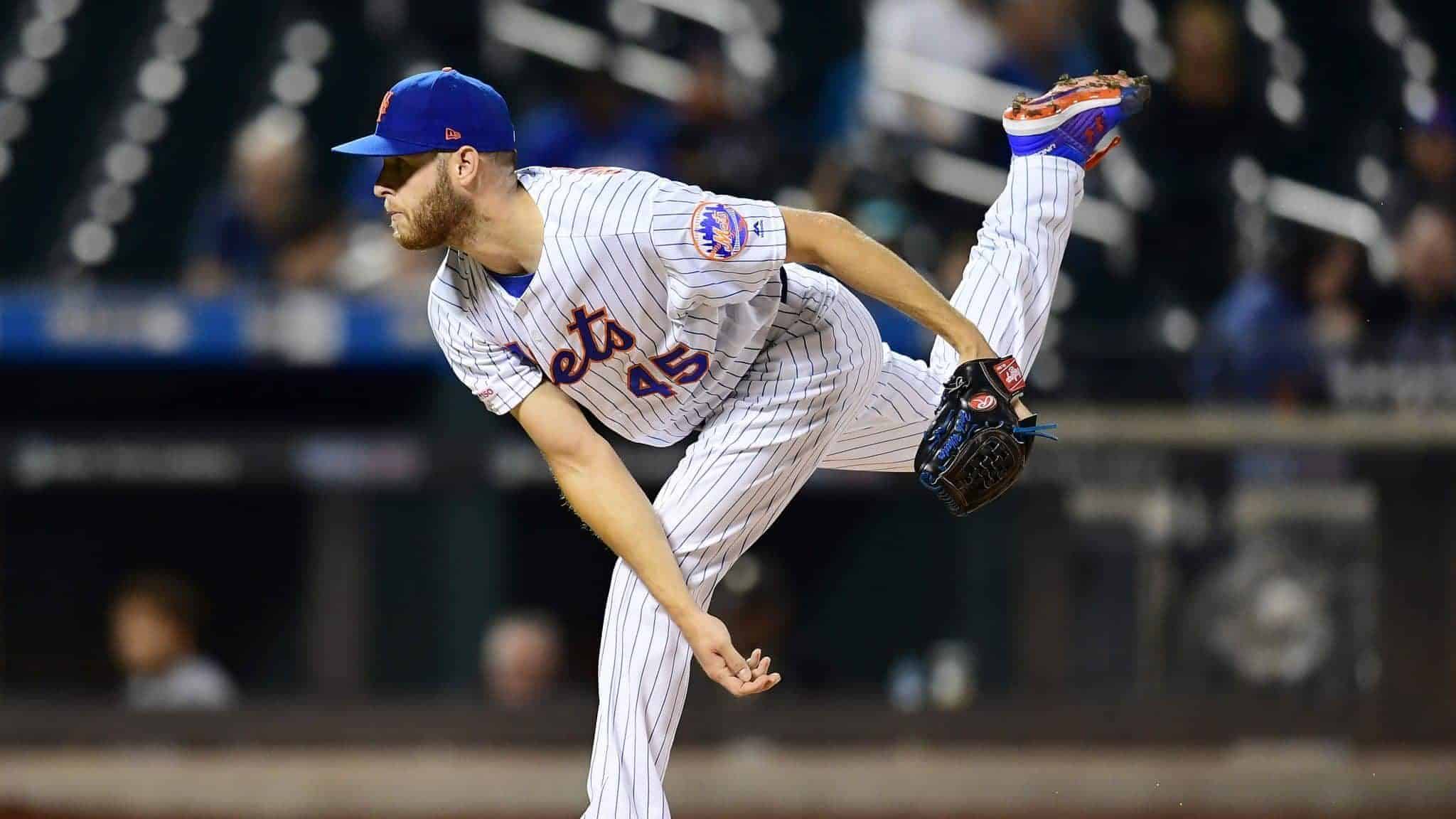 NEW YORK, NEW YORK - SEPTEMBER 26: Zack Wheeler #45 of the New York Mets follows through with a pitch in the first inning of their game against the Miami Marlins at Citi Field on September 26, 2019 in the Flushing neighborhood of the Queens borough in New York City.