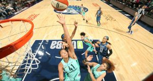 Kiah Stokes (41) of the New York Liberty reaches for the ball against the Minnesota Lynx on June 16 at Target Center in Minneapolis.