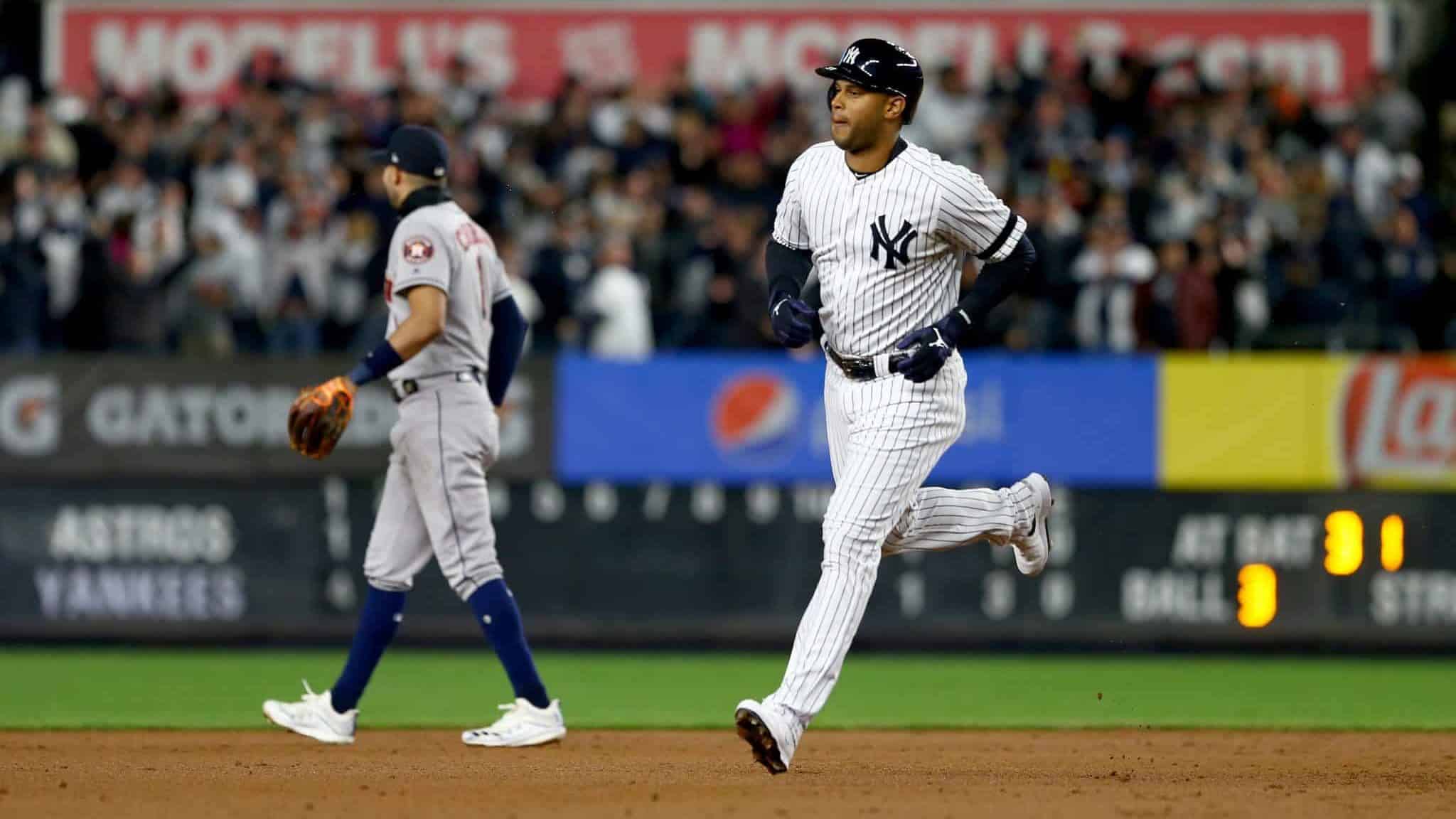 NEW YORK, NEW YORK - OCTOBER 18: Aaron Hicks #31 of the New York Yankees rounds the bases after hitting a three run home run against Justin Verlander #35 of the Houston Astros during the first inning in game five of the American League Championship Series at Yankee Stadium on October 18, 2019 in New York City.