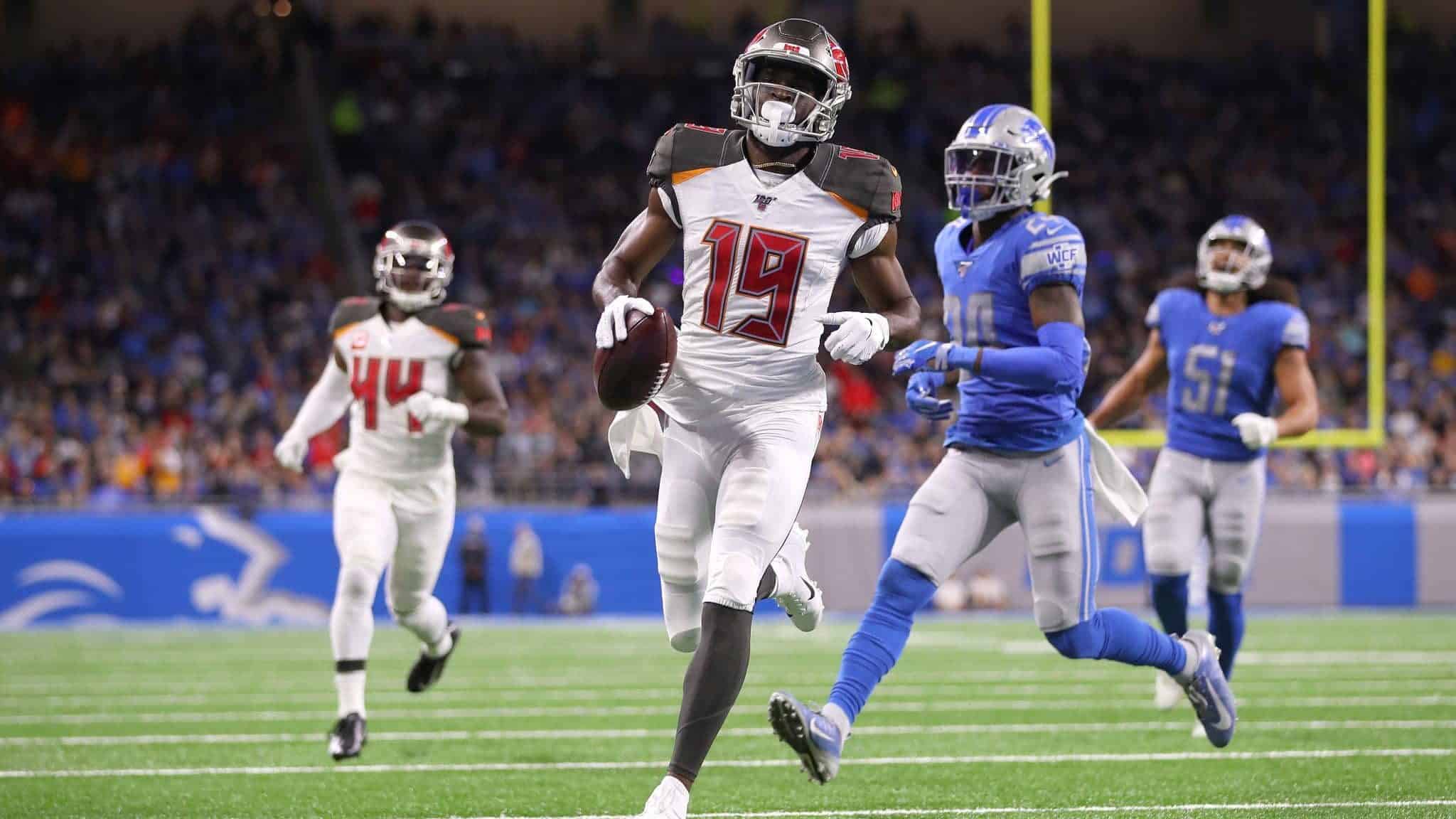 DETROIT, MICHIGAN - DECEMBER 15: Breshad Perriman #19 of the Tampa Bay Buccaneers scores a second quarter touchdown past Amani Oruwariye #24 of the Detroit Lions at Ford Field on December 15, 2019 in Detroit, Michigan.