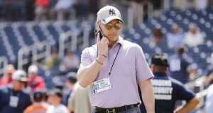 WEST PALM BEACH, FLORIDA - MARCH 12: New York Yankees general manager Brian Cashman talks on the phone prior to a Grapefruit League spring training game between the Washington Nationals and the New York Yankees at FITTEAM Ballpark of The Palm Beaches on March 12, 2020 in West Palm Beach, Florida. Many professional and college sports are canceling or postponing their games due to the ongoing threat of the Coronavirus (COVID-19) outbreak.