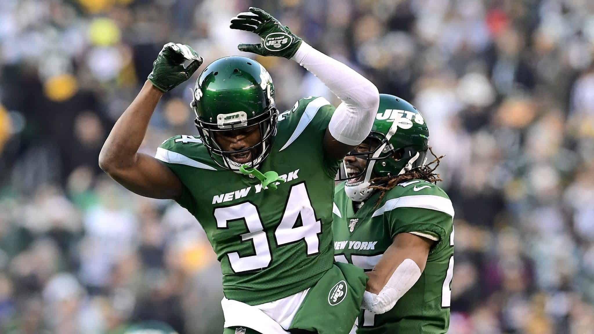 EAST RUTHERFORD, NEW JERSEY - DECEMBER 22: Brian Poole #34 and Darryl Roberts #27 of the New York Jets celebrate after a turnover on downs as their teams defeats the Pittsburgh Steelers 16-10 at MetLife Stadium on December 22, 2019 in East Rutherford, New Jersey.