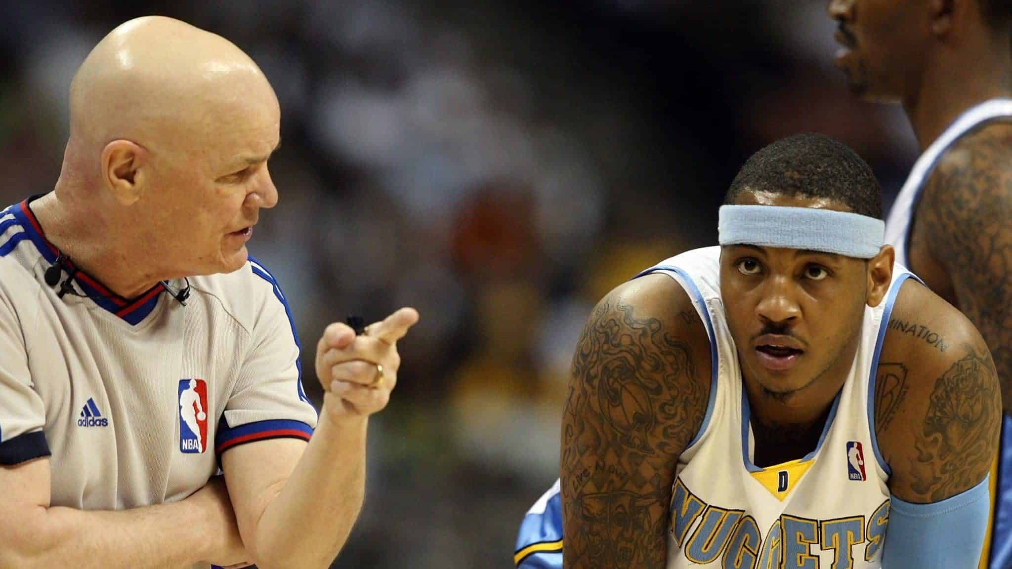 DENVER - MAY 29: Referee Joe Crawford talks with Carmelo Anthony #15 of the Denver Nuggets in Game Six of the Western Conference Finals during the 2009 NBA Playoffs against the Los Angeles Lakers at Pepsi Center on May 29, 2009 in Denver, Colorado. NOTE TO USER: User expressly acknowledges and agrees that, by downloading and or using this photograph, User is consenting to the terms and conditions of the Getty Images License Agreement.
