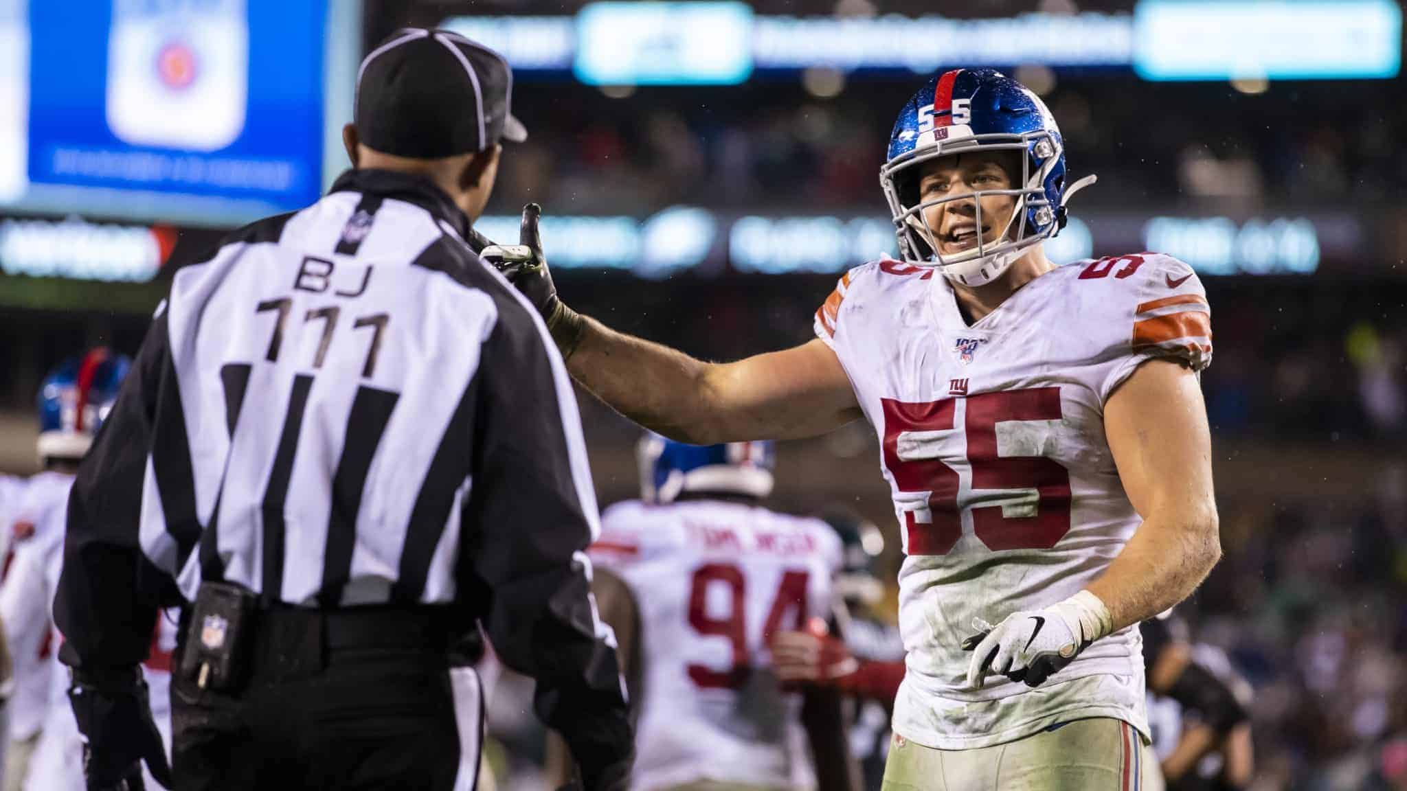 PHILADELPHIA, PA - DECEMBER 09: David Mayo #55 of the New York Giants argues a no call with back judge Terrence Miles #111 during the fourth quarter after a Philadelphia Eagles touchdown at Lincoln Financial Field on December 9, 2019 in Philadelphia, Pennsylvania. Philadelphia defeats New York in overtime 23-17.