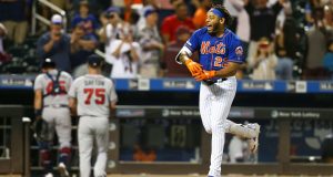 NEW YORK, NEW YORK - SEPTEMBER 29: Dominic Smith #22 of the New York Mets celebrates after hitting a walk-off 3-run home run in the bottom of the eleventh inning against the Atlanta Braves at Citi Field on September 29, 2019 in New York City.