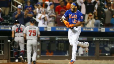 NEW YORK, NEW YORK - SEPTEMBER 29: Dominic Smith #22 of the New York Mets celebrates after hitting a walk-off 3-run home run in the bottom of the eleventh inning against the Atlanta Braves at Citi Field on September 29, 2019 in New York City.