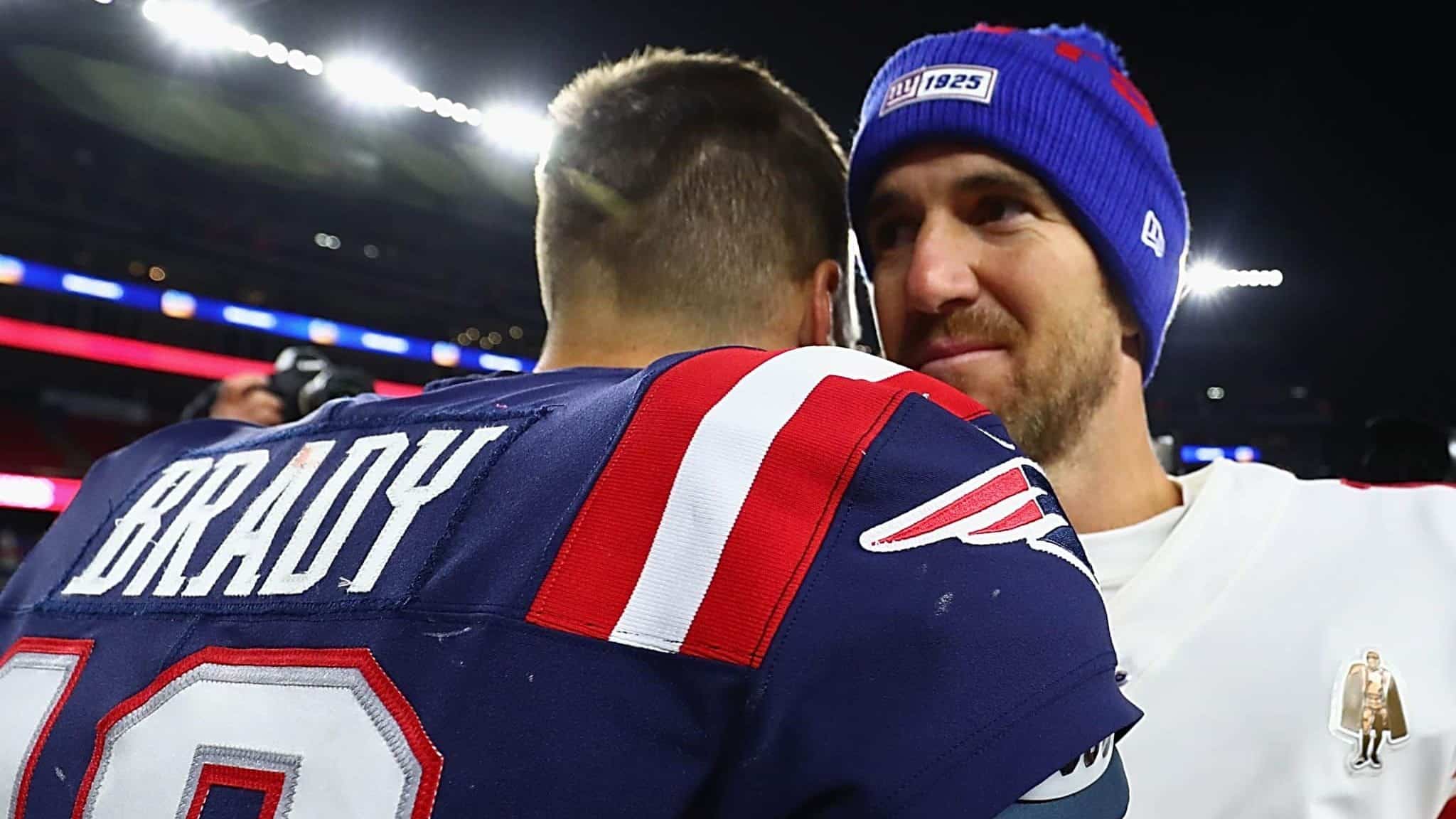 FOXBOROUGH, MASSACHUSETTS - OCTOBER 10: Tom Brady #12 of the New England Patriots shakes hands with Eli Manning #10 of the New York Giants after their game at Gillette Stadium on October 10, 2019 in Foxborough, Massachusetts. The New England Patriots defeated the New York Giants with a score of 35 to 14.