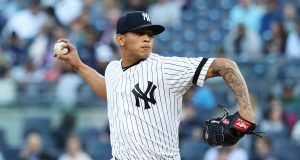 NEW YORK, NEW YORK - MAY 08: Jonathan Loaisiga #43 of the New York Yankees pitches against the Seattle Mariners during their game at Yankee Stadium on May 08, 2019 in New York City.