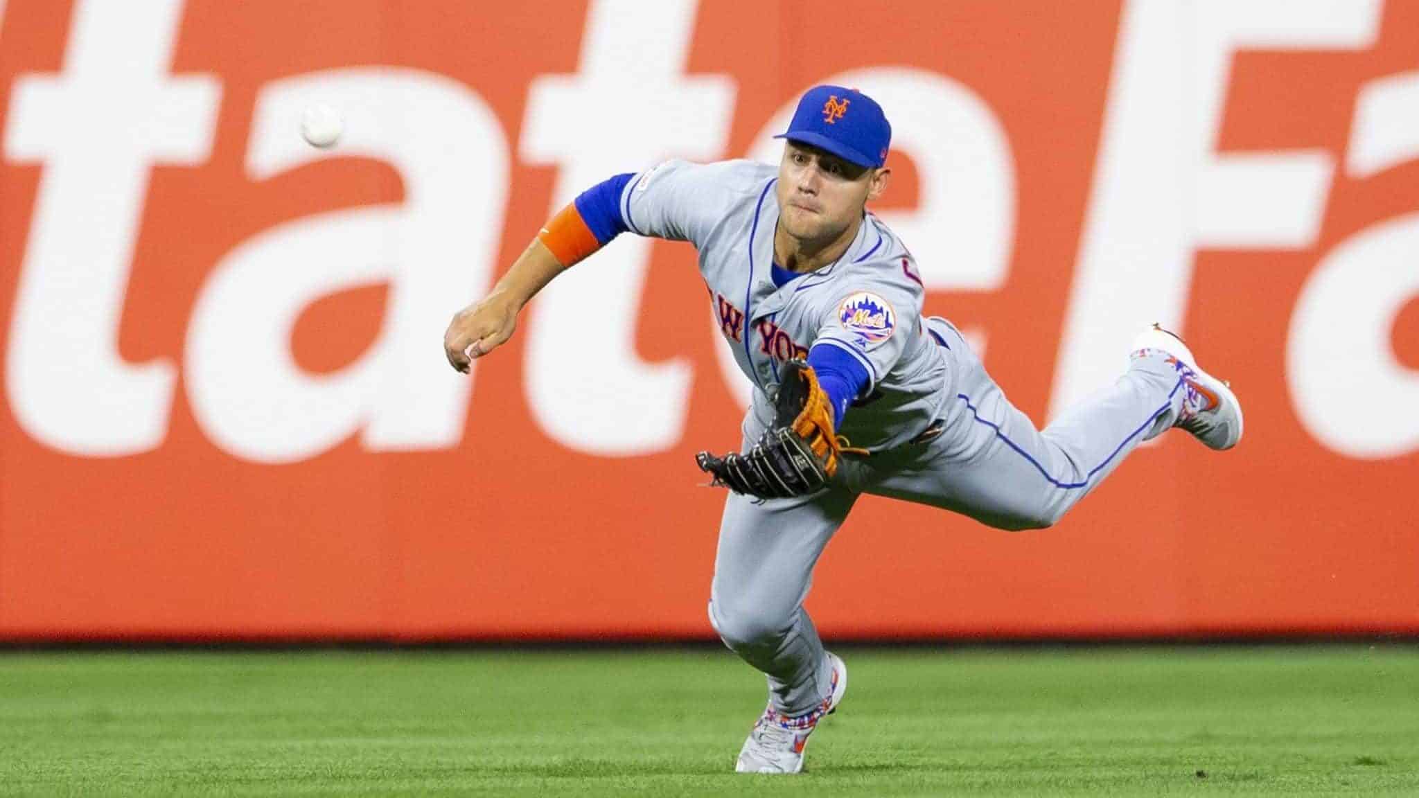 PHILADELPHIA, PA - AUGUST 30: Michael Conforto #30 of the New York Mets makes a diving catch on a ball hit by J.T. Realmuto #10 of the Philadelphia Phillies in the bottom of the fifth inning at Citizens Bank Park on August 30, 2019 in Philadelphia, Pennsylvania. The Mets defeated the Phillies 11-5.
