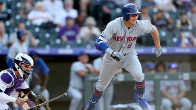 DENVER, COLORADO - SEPTEMBER 18: Brandon Nimmo #9 of the New York Mets hits a RBI single in the ninth inning against the Colorado Rockies at Coors Field on September 18, 2019 in Denver, Colorado.