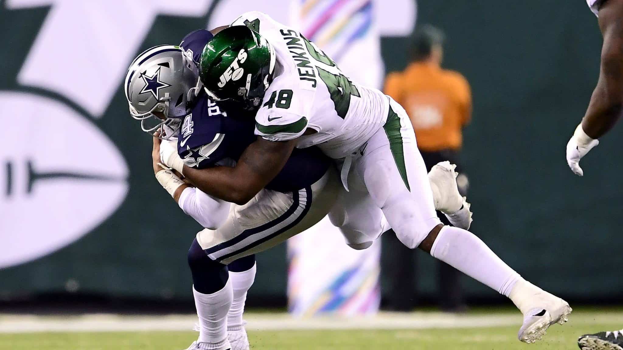 EAST RUTHERFORD, NEW JERSEY - OCTOBER 13: Dak Prescott #4 of the Dallas Cowboys is sacked by Jordan Jenkins #48 of the New York Jets during the fourth quarter at MetLife Stadium on October 13, 2019 in East Rutherford, New Jersey.