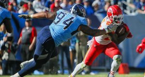 NASHVILLE, TENNESSEE - NOVEMBER 10: Damien Williams #26 of the Kansas City Chiefs rushes past Austin Johnson #94 of the Tennessee Titans during the first half at Nissan Stadium on November 10, 2019 in Nashville, Tennessee.
