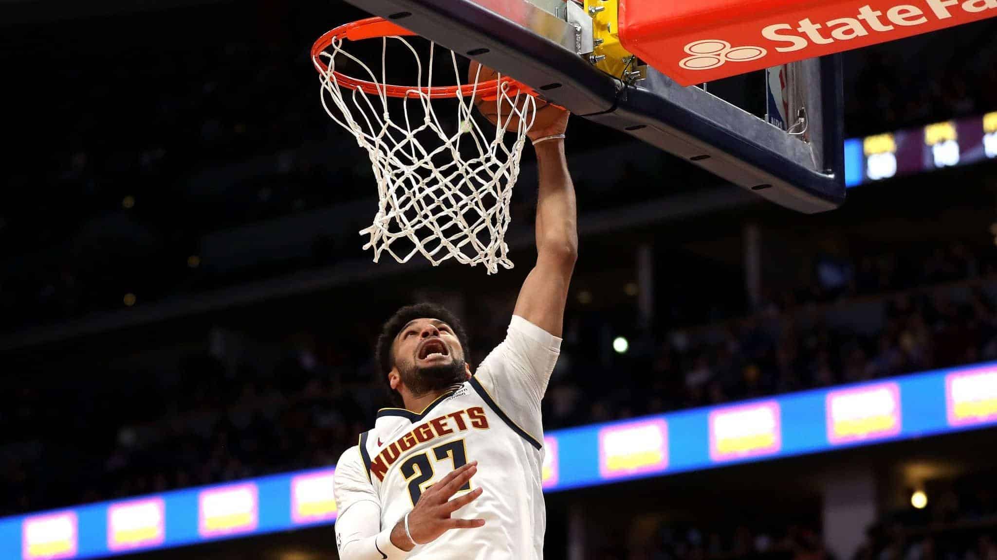 DENVER, COLORADO - JANUARY 11: Jamal Murray #27 of the Denver Nuggets dunks against the Cleveland Cavaliers in the second quarter at the Pepsi Center on January 11, 2020 in Denver, Colorado. NOTE TO USER: User expressly acknowledges and agrees that, by downloading and or using this photograph, User is consenting to the terms and conditions of the Getty Images License Agreement.