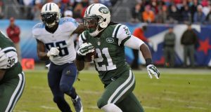 NASHVILLE, TN - DECEMBER 14: Chris Johnson #21 of the New York Jets rushes against the Tennessee Titans during the second half of a game at LP Field on December 14, 2014 in Nashville, Tennessee.